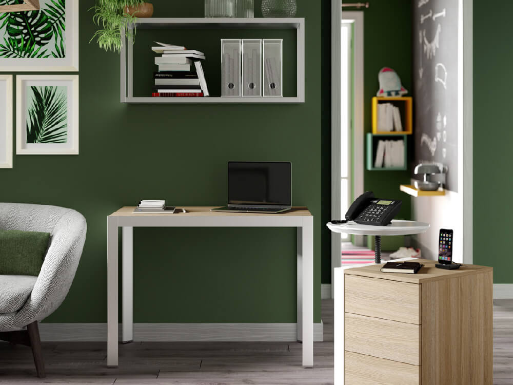 A compact modern home office desk with a wall unit, drawers, and phone stand, ideal for optimising space.